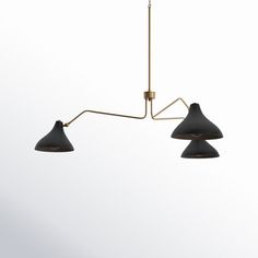 three lights hanging from a ceiling fixture in a room with white walls and flooring