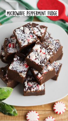 a white plate topped with chocolate peppermint brownies