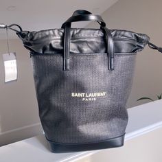 Saint Laurent 3piece Bag (Brand New)Also Comes With Duster Bag!!!Great Deal High-end Tote Bucket Bag For Travel, High-end Bucket Bag Tote For Travel, High-end Bucket Tote Bag For Travel, Designer Bucket Bag With Dust Bag For Errands, Designer Double Handle Bucket Bag For Travel, Luxury Coated Canvas Bucket Bag For Travel, Luxury Large Capacity Bucket Bag For On-the-go, Designer Coated Canvas Bucket Bag With Removable Pouch, Designer Bucket Bag With Leather Handles For Travel