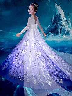 a woman in a white dress is standing on an ice floese with snowflakes around her