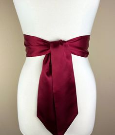 Burgundy Satin Sash  Burgundy Sash Belt  Wide Burgundy Wedding Dress Sash  Bridal Sash, Burgundy Satin Belt  Bridesmaid Sash  Satin Swank  This Satin Swank® reversible waist sash is the perfect finishing touch for your bridesmaid, wedding, or special occasion dress, or just the right piece to add instant polish to your dress or top. Depending on your waist size and the length you choose (60, 75, and 90 inch lengths available), you can wrap the sash around your waist once or twice. You decide whether to tie the sash in a bow or a simple knot with long-hanging tails. Tie in front, in back, or on the side. Luxury charmeuse satin fabric in rich burgundy on both sides means there is no wrong side of the sash peeking through, resulting in the perfect finishing touch for your special occasion tha Fitted Sashes With Satin Bow, Wedding Sash With Tie Back, Elegant Satin Sash With Tie Back, Satin Bridal Belt For Bridesmaids, Fitted Bridesmaid Sash, Elegant Fitted Tie Waist Sash, Elegant Fitted Tie-waist Sash, Fitted Ribbon Sash For Wedding, Wedding Sashes With Satin Finish