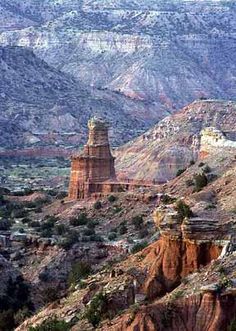 a large rock formation in the middle of a desert