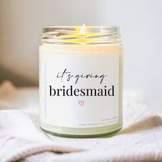 a candle that is sitting on top of a towel with the words, it's spring bridesmaid