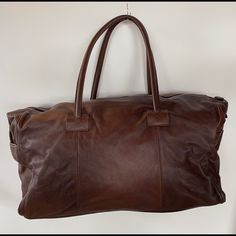 Brand New, Never Used Gorgeous Brown Spinneybeck Leather Weekender. Spinneybeck Has Been Supplying The Highest Quality Leather To Architects And Interior Designers For Decades. Overall Dimension 26” L X 12”W X 12” H X 13” Strap Has Original Red Dust Cover Bag Bundle With Other Brown Spinneybeck Luggage And Get 20% Off Designer Leather Tote Weekender Bag, Designer Brown Satchel With Luggage Sleeve, Elegant Soft Leather Brown Weekender Bag, Designer Leather Rectangular Weekender Bag, Designer Brown Leather Travel Bag, Elegant Brown Leather Weekender Bag, Designer Leather Satchel Weekender Bag, Designer Brown Weekender Bag For Everyday Use, Elegant Brown Soft Leather Weekender Bag