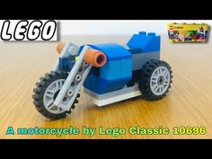 a toy motorcycle made out of legos on a wooden table with the words, lego classic