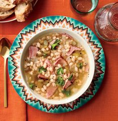 a bowl of soup with ham and beans