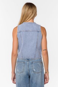 The Kiana Denim Vest in a vintage wash is a fun styling piece to add a wardrobe. It has a western vibe with metal buttons and can be worn alone or layered over a top. Material: 100% Cotton. Machine wash Color: 925 Retro Blue Model is 5'9" and wearing a size S Imported