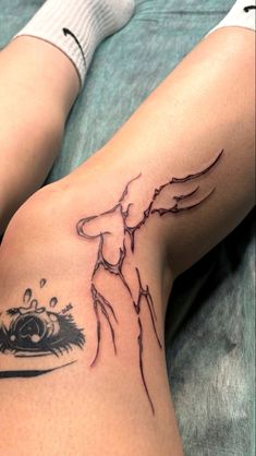 a woman's leg with a tattoo on it