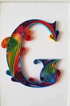 the letter c is made out of colored paper