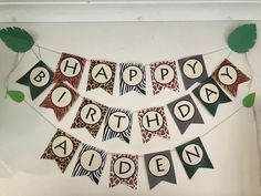 a happy birthday banner with leaves on it