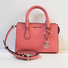 New With Tag Michael Kors Sheila Small Satchel Shoulder Crossbody Bag Vegan Leather Tea Rose 100% Authentic Retail: $498.00 Plus Tax **Please See The Measurement For The Size** No Dust Bag Michael Kors Logo At Front Silver Toned Hardware 1 Mk Charm Zip Top Closure Triple Compartment With Center Zip Custom Fabric Lining 1 Slip-In Pocket 9" (Bottom) X 6.5"(H) X 3"(D) Straps: 3.5" Adjustable Strap: 20.25"-23.75" Very Clean, Smoke-Free And Pet-Free Environment. Michael Kors Spring Bags With Detachable Strap, Tea Rose Color, Bag Michael Kors, Michael Kors Logo, Tea Rose, Tea Roses, Rose Color, Zip Top, Michael Kors Bag