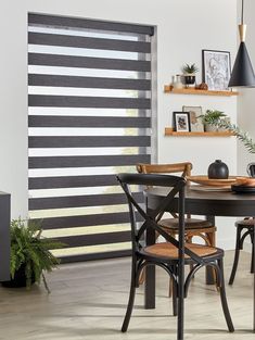 a black and white striped blinds in a dining room