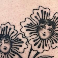 two sunflowers with faces on them are shown in black and white tattoo art