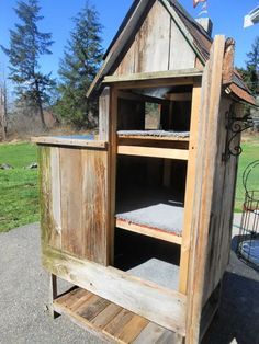 an old outhouse is being used as a pet house