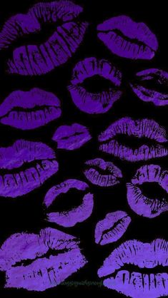 purple lipstick drawn on black paper with white writing