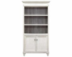 a white bookcase with two doors and drawers