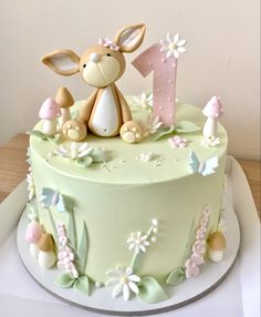 a cake decorated with an animal and flowers