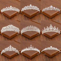 many tiaras are arranged on a wooden surface