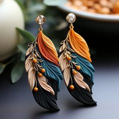 the earrings are decorated with feathers and beads