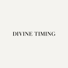 the words divine time are black and white