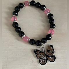 Beads Are Obsidian And Pink Jade. Silver Tone Spacers. Butterfly Charm With Skull Casual Pink Gemstone Beaded Bracelets, Pink Jewelry With Black Beads For Gift, Black Bracelets With Spacer Beads, Black Crystal Bracelet With Spacer Beads For Gift, Gift Black Crystal Bracelet With Spacer Beads, Black Crystal Bracelet As Gift, Silver Star Bracelet, Royal Au, Diy Kandi Bracelets