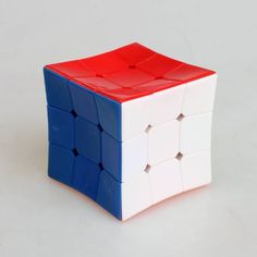 a red, white and blue cube is shown