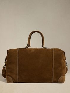 Classic Travel Bag With Palladium Hardware, Travel Bags With Palladium Hardware In Brown, Suede Travel Bag With Leather Trim, Travel Suede Bag With Leather Trim, Leather Travel Bag With Suede Lining, Rugged Weekender Bag With Luggage Sleeve For Everyday, Classic Satchel With Leather Trim For Overnight Trips, Luxury Travel Bags With Suede Lining, Travel Suede Satchel With Leather Handles