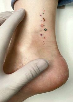 a person with a small tattoo on their foot