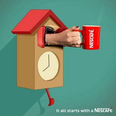 a person holding a red coffee mug in front of a bird house with a clock on it