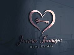 the logo for jennya thompson real estate, with a heart shaped key on it