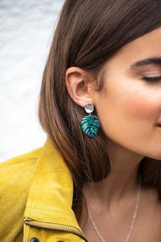 Gorgeous lucite green leaves hang on gold or silver organically shaped leaf posts.  These leaves are multi tonal and very detailed, light weight but have a luxurious look.  NEW!  Now available in matte silver!  Matching necklace photoed at 18," here: https://www.etsy.com/listing/641359984D E T A I L S :-Green leaves measures 3/4" by 1"-Total length of earrings is 1 1/2" long-Gold or silver plated organic shaped ear posts………………………………….H A N D M A D E ∙ L O V I N' • We hand make all pieces in our Green Botanical Drop Earrings Jewelry, Green Leaf-shaped Earrings For Pierced Ears, Trendy Green Leaf-shaped Jewelry, Unique Green Leaf-shaped Jewelry, Green Leaf-shaped Botanical Jewelry, Green Leaf-shaped Earrings, Monstera Leaf Earrings, Summer Plant, Earrings Outfit