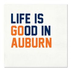 a napkin with the words life is good in auburn on it and an orange, blue, and white design