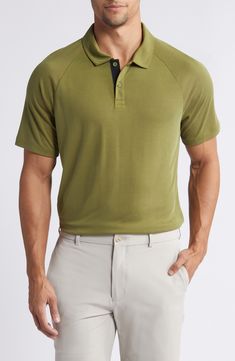 Sweat-wicking fabric brings all-activity comfort to a golf polo made of a soft piqué knit and styled to go easily from the course to the clubhouse. 27 1/2" front length; 28" back length (size Medium) Button half-placket Spread collar Short sleeves Moisture-wicking fabric engineered for dryness and comfort Reflective logo enhances visibility in low light or at night 66% rayon, 34% polyester Machine wash, tumble dry Imported Relaxed Fit Short Sleeve Golf Polo Shirt, Relaxed Fit Short Sleeve Polo Shirt For Golf, Functional Golf Tops With Polo Collar, Green Polo Collar Tops For Golf, Sporty Collared Golf Polo Shirt, Classic Moisture-wicking Tops For Golf, Green Fitted Sports Polo Shirt, Fitted Green Polo Shirt For Sports, Classic Polo Shirt With Seamless Collar For Golf