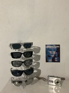 the sunglasses are stacked on top of each other