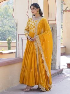 This stunning gown is perfect for any special occasion, with its vibrant yellow color and intricate sequin and embroidered work. The silk dupatta complements the gown beautifully, featuring matching sequin and embroidered work along with designer lace detailing.
Not only is it fully stitched and available in sizes XS to XXL, but it also has a generous 3.50-meter flair and a gown length of 56 inches. The 2.3-meter-long dupatta adds an elegant touch, making this ensemble a must-have for festivals, Haldi Wear, Engagement Gown, Lehenga Crop Top, Floral Lehenga, Lehenga Choli Wedding, Party Wear Lehenga Choli, Reception Gown, Bollywood Lehenga, Cocktail Wear