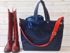 Navy Canvas Tote Bag,  Blue Sapphire Tote bag Unisex Durable and Versatile Waxed canvas bag It has Key Fob, top handles, and an adjustable strap, so you can carry it in-hand or on your shoulder or crossbody. Webbing strap shortest makes shoulder strap.Fully lined with Orange color fabric. BAG FEATURES:• Handmade at my HOME ATELIER• 14 OZ Navy Waxed canvas • Fully lined with 14 oz waterproof fabric.• Key Holder• Inside 1 LARGE ZIPPER and 5 useful pockets• 6 " Drop Handle• Webbing Crossbody / Shou Navy Shoulder Bag With Top Carry Handle For On-the-go, Navy Tote Bag With Top Carry Handle, Everyday Navy Bag With Handles, Navy Shoulder Bag With Handles, Everyday Navy Bags, Blue Canvas Bag With Leather Handles For Shopping, Functional Navy Shoulder Bag For Everyday Use, Blue Canvas Satchel Bag With Handles, Navy Double Handle Bag For Daily Use