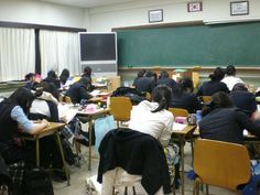 a classroom full of students sitting at desks