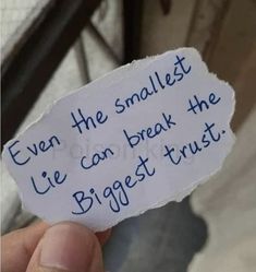 someone holding up a piece of paper that says even the smallest lie can break the biggest trust