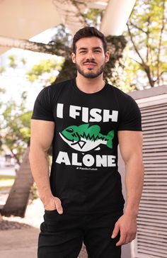 I Fish Alone. Have some fun with this tshirt, then go fishing. Remember, you're just one cast away. Link to women's tshirt - https://www.etsy.com/listing/1127780801 Link to Awesome Coffee Mug ---> https://www.etsy.com/listing/1113539584 Link to YouTube FishOutLoud - https://bit.ly/YouTubeFOLa Please Note: We do not charge shipping EVER and we offer the highest quality, highest customer review shirts anywhere. This classic unisex jersey short sleeve tee fits like a well-loved favorite. Soft cotton and quality print make users fall in love with it over and over again. These t-shirts have-ribbed knit collars to bolster shaping. The shoulders have taping for better fit over time. Dual side seams hold the garment's shape for longer. .: 100% Airlume combed and ringspun cotton (fiber content may Fish Gifts, Fun Tshirt, Women's Tshirt, Mens Fishing Shirts, Hero Black, Fish Man, Customer Review, Fishing Gifts, Fishing Shirts