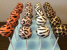 there are many zebra print cake pops on the stick