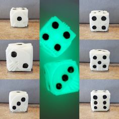 four dices with black dots on them sitting on a table