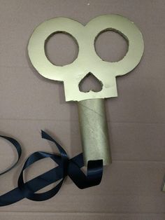 a skeleton key with a ribbon tied around it