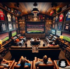 two men sitting on couches in a sports themed living room