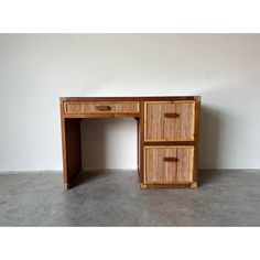 a wooden desk with two drawers on it