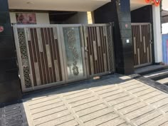 an entrance to a building with metal gates