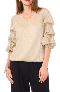 Simmered in shimmer and set with elegant statement sleeve, this party-ready top will get glasses raised in tribute. 24" length V-neck Three-quarter sleeves 100% polyester Machine wash, tumble dry Imported Glamorous V-neck Blouse For Party Season, Glamorous V-neck Blouse, Glamorous Formal V-neck Blouse, V-neck Shimmer Tops For Party Season, Elegant Spring Blouse With Shimmer, Elegant V-neck Tops For Festive Occasions, Elegant V-neck Blouse For Party Season, Elegant V-neck Holiday Tops, Chic Shimmer Blouse For Spring