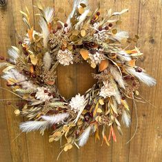 Dress up your front door for fall with this fall foliage and pampas grass wreath. Beautiful Boho wreath can be used on your entryway door or on a wall as decor.  This wreath is packed with fall foliage...wheat, fall grasses, harvest mustard foliage, cream foam flowers, and pinecones.  All are faux and created on a grapevine base.  This wreath would make a great gift fir a birthday, housewarming or a fall wedding.  All wreaths are handmade to order. This wreath is built on a 14" base which when completed makes approximately a 22" wreath perfect fir a front door.  Please check out my other listings at my shop....www. Blossombubblescrafts@etsy.com. Pampas Grass Wreath, Fox Tails, Boho Autumn, Entryway Door, Basket Wreath, Boho Wreath, Foliage Wreath