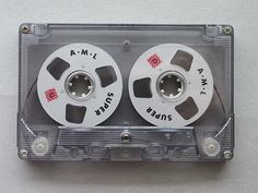 two reels are attached to the back of a cassette tape dispenser