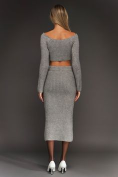 Elevate your everyday look with this chic High-Waisted Knit Midi Skirt. This fitted midi skirt hugs your curves in all the right places, and can even be paired with the matching sweater for a completed look! It's easy to dress this skirt up or down, making it a must-have item for your wardrobe! Knit Ribbed at waist Sits high-waisted Fitted Midi length Hand wash cold Do not bleach Do not tumble dry Iron low Shell: 44% Nylon 18% Acrylic 17% Polyester 11% Wool 10% Rayon HN1319K Total length: 31" Wa Fitted Midi Skirt, Knit Loungewear, Strapless Bodycon Dress, Matching Sweaters, Cropped Knit Sweater, Faux Leather Mini Skirt, Knit Midi Skirt, Cropped Long Sleeve, Leather Mini Skirt