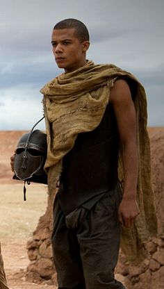 an image of a man with a helmet on his head and the caption grey worm